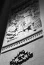 Bas-relief of the wall. Black and white night photo.