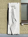Moscow, Russia, March, 21, 2022. Bas-relief on the wall of the house at the address: Moscow, Uspensky lane, 3a
