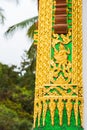 The bas-relief on the wall of the temple in Louangphabang, Laos. Close-up. Vertical. Royalty Free Stock Photo