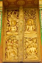 The bas-relief on the wall of the temple in Louangphabang, Laos. Close-up. Vertical. Royalty Free Stock Photo