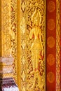 The bas-relief on the wall of the temple in Louangphabang, Laos. Close-up. Vertical. Royalty Free Stock Photo