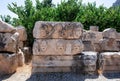 Bas reliefs on the ancient stone. Faces are carved in stone Royalty Free Stock Photo