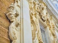 Bas-relieves in a baroque facade. Italian style