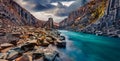 Basalt cliffs in deep canyon of mountain river. Dramatic spring view of Studlagil Canyon