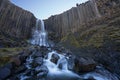 Basalt columns waterfall in Studlagil Canyon, Iceland Royalty Free Stock Photo