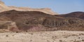 Basalt Hill with Prisms and Colorful Soils in the Makhtesh Ramon Crater in Israel