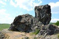 Basalt rock formation on a hill former stone quarry Royalty Free Stock Photo