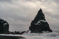Basalt rock formations Troll toes on black beach. at storm Reynisdrangar, Vik, Iceland Royalty Free Stock Photo