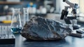 Basalt Rock Sample on Laboratory Table Next to Scientific Equipment Royalty Free Stock Photo