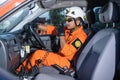 A Basarnas rescue team communicating in a car