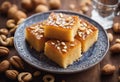 Basbousa or namoora traditional arabic semolina cake with cashew nuts and syrup. Selective focus