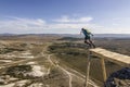 Base-jumper jumps from the cliff