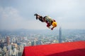A BASE jumpers in jumps off from KL Tower.