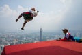 A BASE jumpers in jumps off from KL Tower.