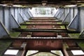 The base of an old sea crane. Rivets and rust on old metal beams. Royalty Free Stock Photo