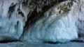 The base of the rock is covered with a thick layer of bizarre icicles and splashes.