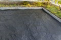 The base for tiling is prepared using a membrane that suppresses the growth of weeds and prevents mixing of rubble and earth.