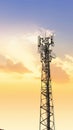 Communication tower network antenna for cellular telephone with sunset orange sky Royalty Free Stock Photo