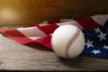 Baseball with American flag on the wooden table background Royalty Free Stock Photo