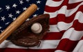 Baseball ball, bat and glove on American flag Royalty Free Stock Photo