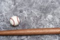 Baseball ball and bat on grey background. Team sport concept Royalty Free Stock Photo