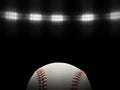 Baseball ball on a black background under stadium lights Royalty Free Stock Photo