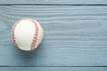 Baseball ball on grey wooden table, top view. Space for text Royalty Free Stock Photo