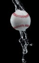 Baseball ball hit water and splash in air. Baseball ball fly in rain and splatter splash in droplet water. Black background