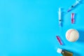 Baseball ball near syringe and ampoule, bottle on blue background. Concept of doping in sport Royalty Free Stock Photo