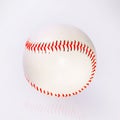 Baseball ball with red firmware on the table with reflection Royalty Free Stock Photo