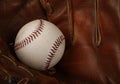 Baseball ball in vintage leather glove Royalty Free Stock Photo