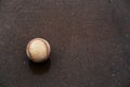 Baseball ball on wet concrete Royalty Free Stock Photo