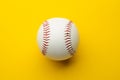 Baseball ball on yellow background with copy space Royalty Free Stock Photo