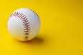 Baseball ball on yellow background with copy space Royalty Free Stock Photo