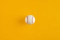 Baseball ball on yellow background with copy space Royalty Free Stock Photo