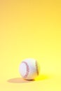 Baseball ball on yellow background. Team sport concept Royalty Free Stock Photo