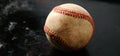 Old rugged baseball closeup with dark background