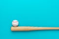 Baseball bat and ball on turquoise blue Royalty Free Stock Photo