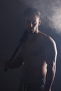 Baseball bat, fitness and man ready for a game on a black studio background. Sport, match and baseball player holding a Royalty Free Stock Photo