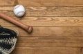 Baseball bat, glove and ball on wooden floor.  Sport theme background with copy space for text and advertisment Royalty Free Stock Photo