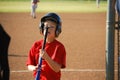 Baseball boy staring at bat Royalty Free Stock Photo