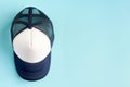 Baseball cap on blue background composition. Flat lay Royalty Free Stock Photo