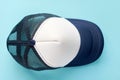 Baseball cap on blue background composition. Flat lay Royalty Free Stock Photo