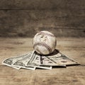 Baseball and dollars, concept sport betting Royalty Free Stock Photo