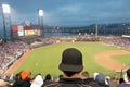 Baseball fan watching night game in San Francisco.