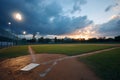 Baseball field at sunset with dramatic clouds Royalty Free Stock Photo