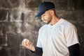 Baseball field, thinking or man with a ball in training ready for match or game on bench dugout in summer. Workout Royalty Free Stock Photo