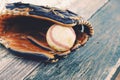 Baseball and glove on dugout bench Royalty Free Stock Photo