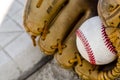 Baseball game mitt and ball on home plate / base Royalty Free Stock Photo