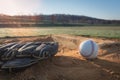 Baseball glove and ball on pitcher`s mound Royalty Free Stock Photo